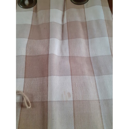 102 - A pair of full length thick cotton curtains in tan and cream check having a  black out lining and ri... 