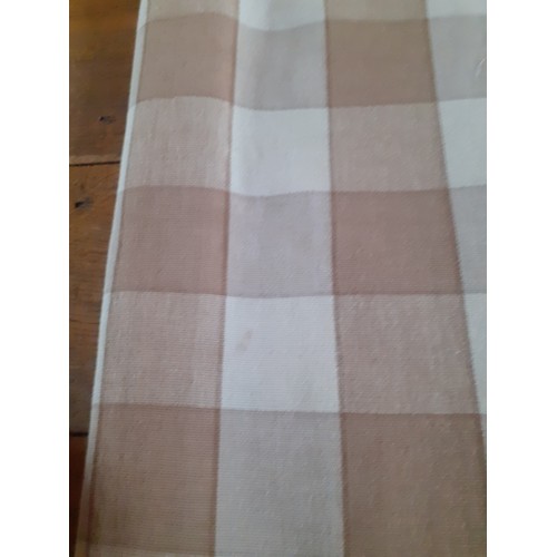 102 - A pair of full length thick cotton curtains in tan and cream check having a  black out lining and ri... 