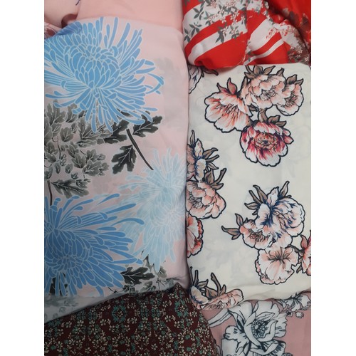 192 - Four large bags of dress making/clothing fabric remnants to include floral and patterned designs. Lo... 