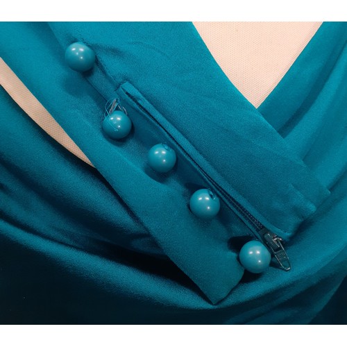 54 - Yves Saint Laurent, French designer- A Saint Laurent Rive Gauche green/teal silk blouse having zippe... 