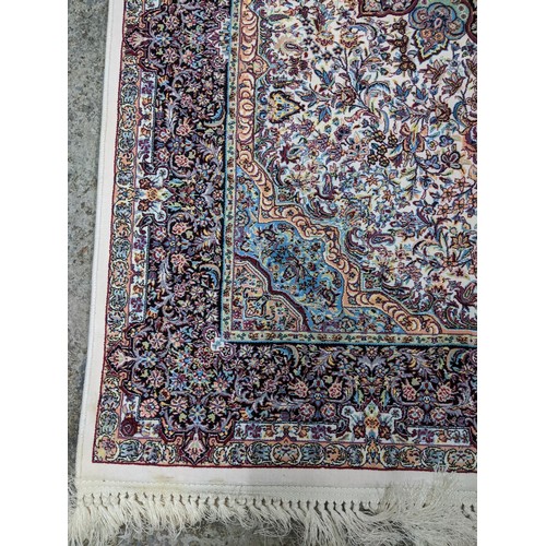 422 - A contemporary small Persian style, machine woven rug, floral design with borders around a central m... 