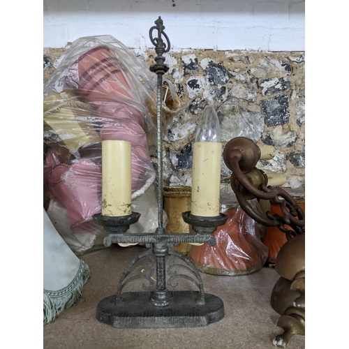 427 - A quantity of various fabric light shades, two pairs of brass wall lights and a lead filled metal tw... 