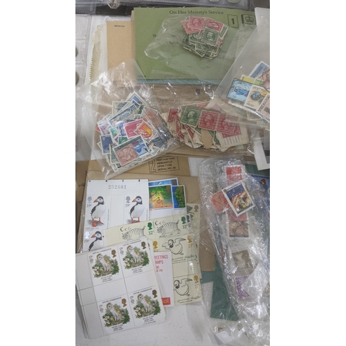 163 - A quantity of first day covers together with mainly British stamps loose and an album of coins form ... 