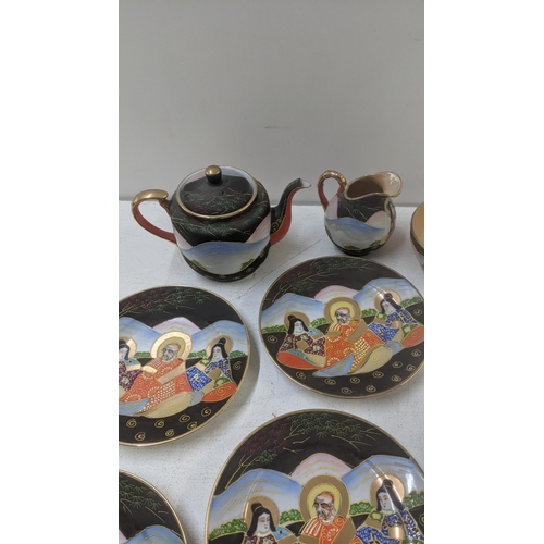 169 - A 20th century Satsuma tea service to include a set of 6 cups, saucers, side plates, a teapot, milk ... 