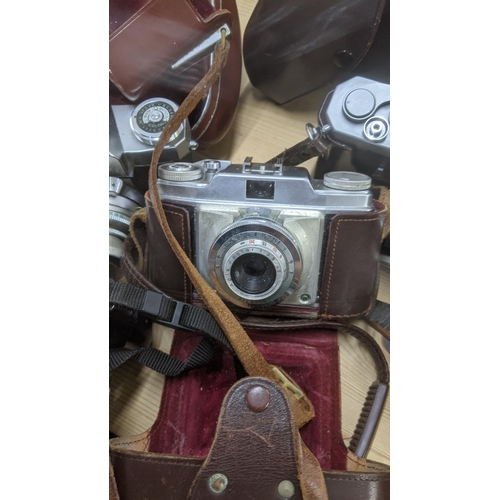 199 - A group of mixed vintage cameras to include a Canon E05 1000, a Contaflex, a Nikkor mat and others t... 