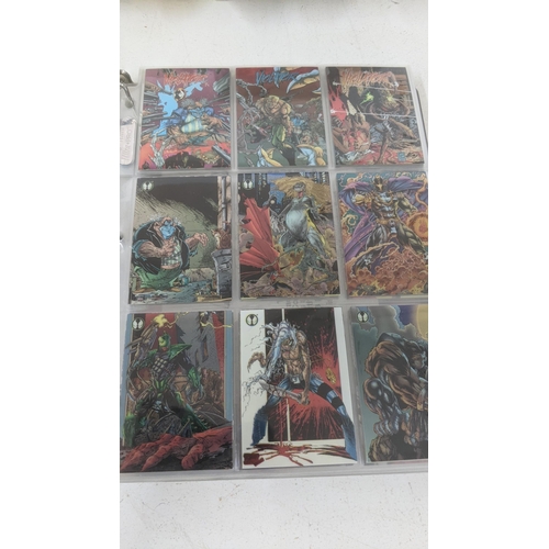 219 - Spawn toys to include three toys and a full album of Spawn collectors cards
Location: 5-4
If there i... 