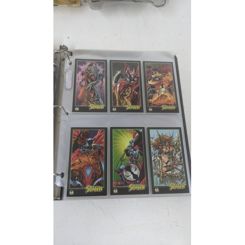 219 - Spawn toys to include three toys and a full album of Spawn collectors cards
Location: 5-4
If there i... 