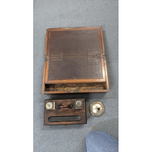 33 - A Victorian mahogany writing slope with fitted interior and brass bound together with a desk writing... 