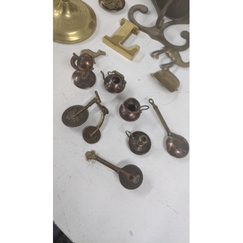 361 - Mixed brassware and metalware to include scale weights, a pair of candlesticks, miniature items made... 