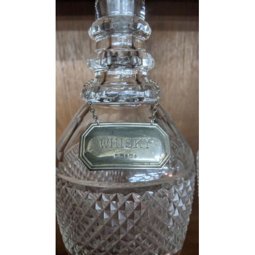 372 - Two crystal cut glass decanters with silver decanter labels to include Whisky and Brandy labels
Loca... 