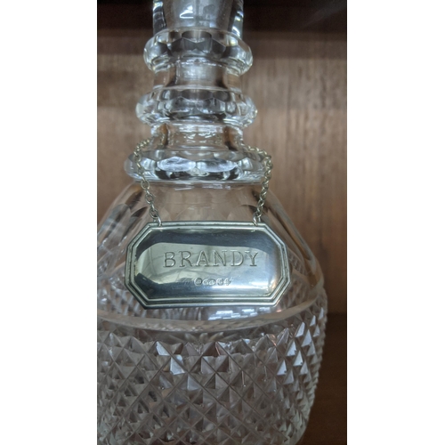 372 - Two crystal cut glass decanters with silver decanter labels to include Whisky and Brandy labels
Loca... 