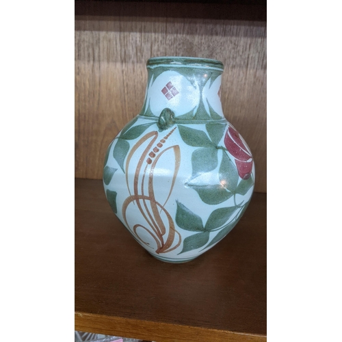 373 - A Lawrence Mcgowan pottery vase painted with flowers and foliage detail
Location:BWL
If there is no ... 