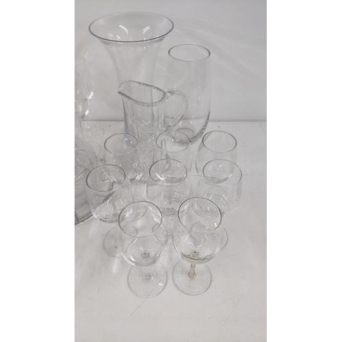 4 - Glassware to include three boxes of Champagne flutes, wine glasses, a crystal cut glass cake dish, a... 