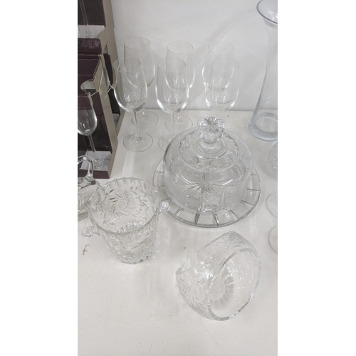 4 - Glassware to include three boxes of Champagne flutes, wine glasses, a crystal cut glass cake dish, a... 