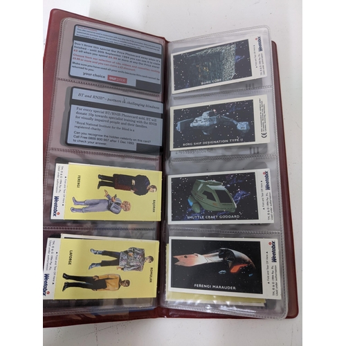 516 - An album of BT and other phonecards to include those depicting Star Trek characters, Japanese topogr... 