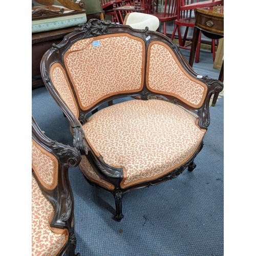 327 - A pair of early 20th century Louis XV style wingback chairs with upholstered seats and back raised o... 