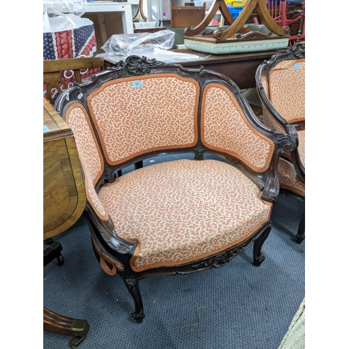 327 - A pair of early 20th century Louis XV style wingback chairs with upholstered seats and back raised o... 