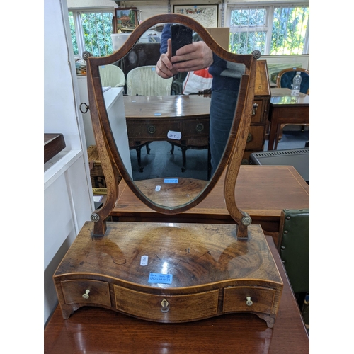 332 - A two-tier stand with a single drawer, and an early 20th century shield shaped toilet mirror with th... 