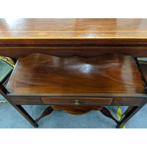 335 - A late 19th/early 20th century mahogany and boxwood inlaid two tier table with a single drawer and a... 