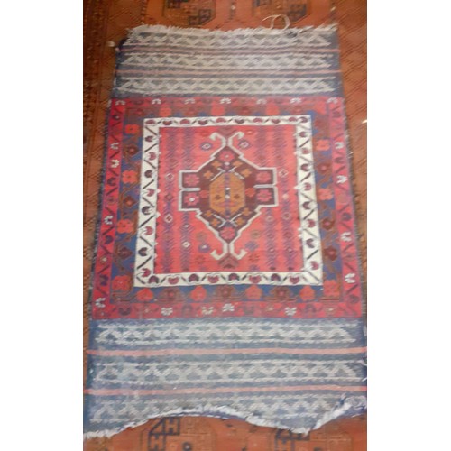 502 - Two Turkish rugs comprising a brown ground rug 240cm x 127cm and a smaller red and blue ground praye... 