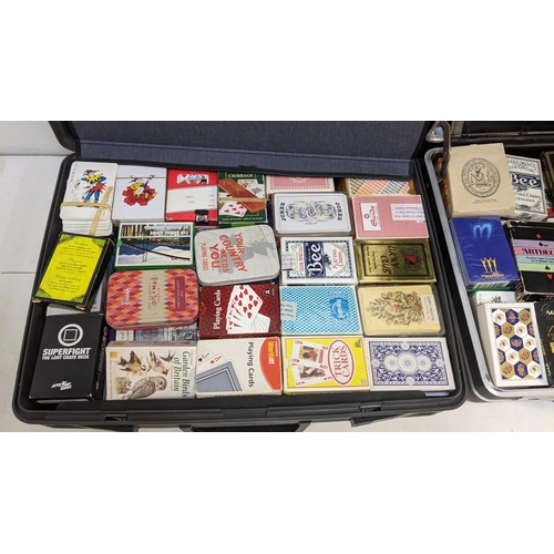 263 - A large collection of novelty playing cards to include a sealed pack of Manchester 2002 Commonwealth... 