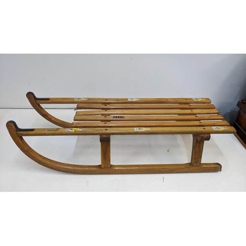 265 - A vintage Austrian sledge measuring 91cm x 29cm
Location: SR
If there is no condition report, please... 