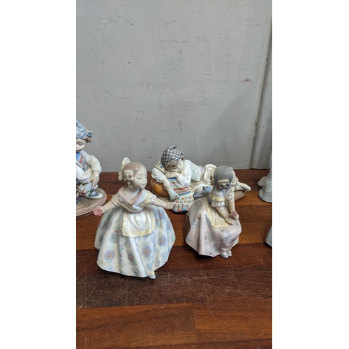 322 - A collection of Lladro figures to include 'Lady with Fan', 'Sleepy Kitten', 'Valencian Boy' and othe... 