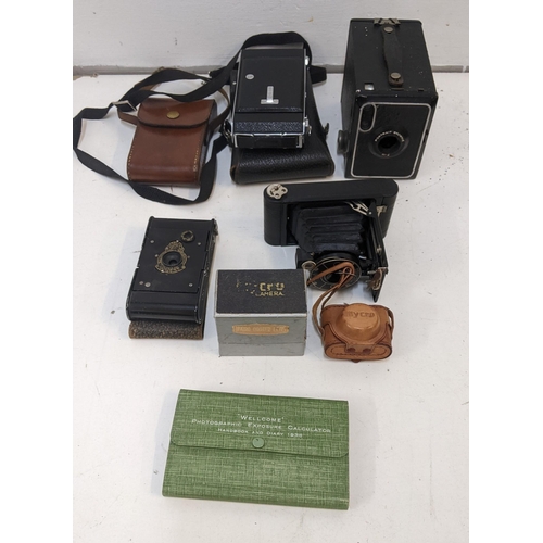 42 - A group of vintage cameras to include a Mycro camera with original box and leather case, a Kadak, a ... 