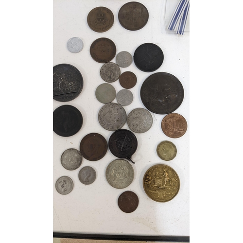 43 - A collection of coins and collectable items to include a cartwheel penny dated 1797, a coin from the... 