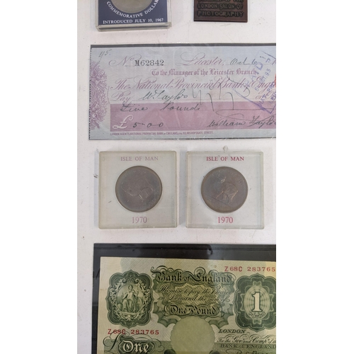 43 - A collection of coins and collectable items to include a cartwheel penny dated 1797, a coin from the... 