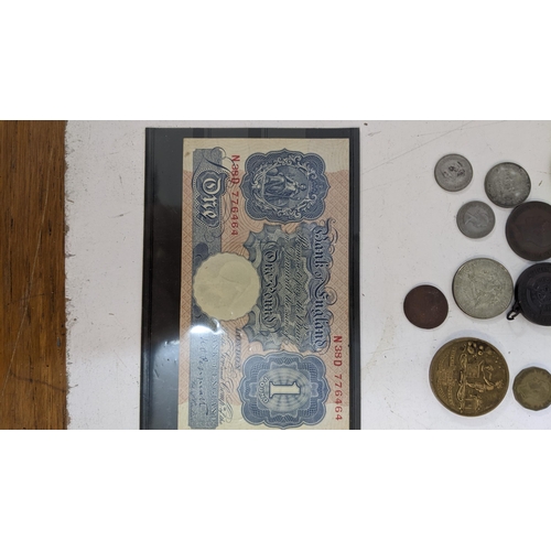 43 - A collection of coins and collectable items to include a cartwheel penny dated 1797, a coin from the... 