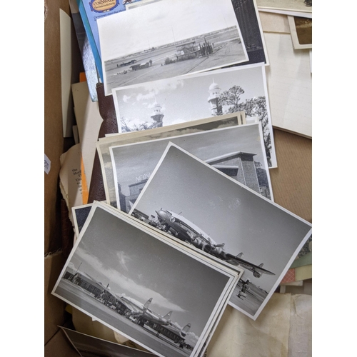 457 - A mixed lot comprising photography accessories and ephemera, vintage postcards and photos, aviation ... 