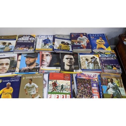 59 - A collection of Leeds United home and away programmes dating from 1986-2005 to include Champions Lea... 