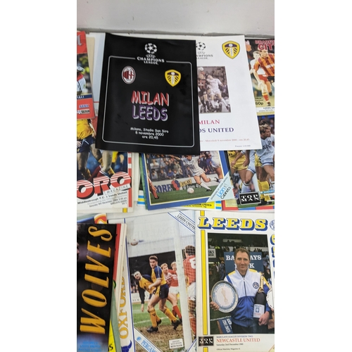 59 - A collection of Leeds United home and away programmes dating from 1986-2005 to include Champions Lea... 