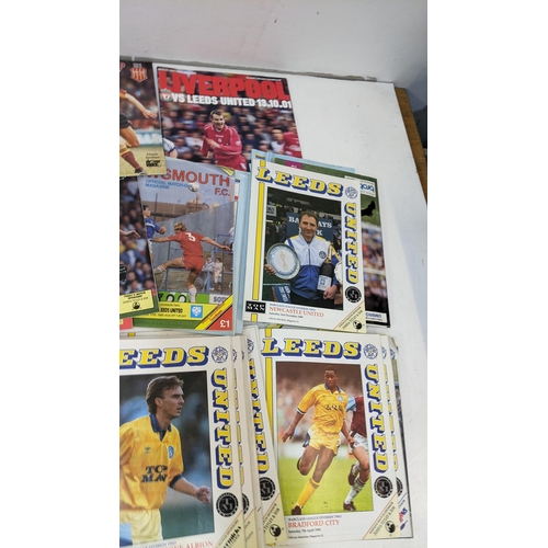 59 - A collection of Leeds United home and away programmes dating from 1986-2005 to include Champions Lea... 