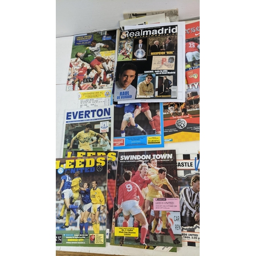 59 - A collection of Leeds United home and away programmes dating from 1986-2005 to include Champions Lea... 