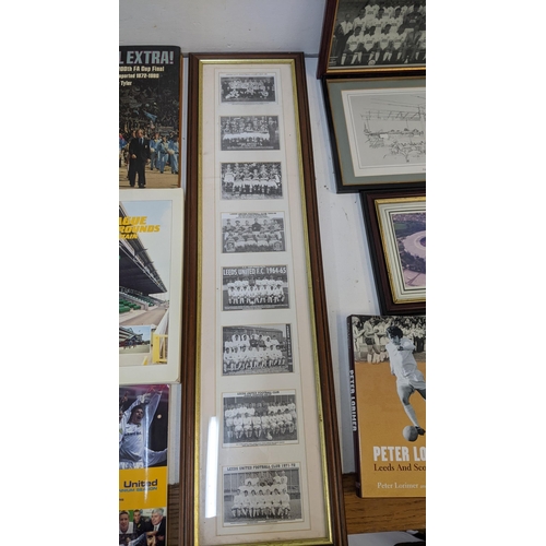 63 - A collection of sporting related items to include Leeds United related books and framed pictures and... 