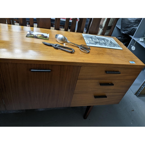 157 - A mid-century retro Uniflex teak sideboard with leather clad handles, cutlery drawer above two furth... 