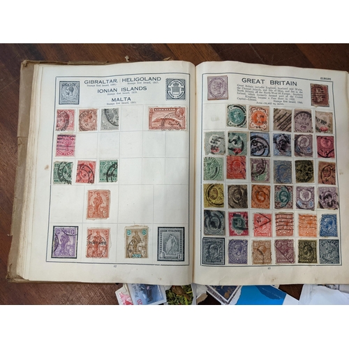 293 - Stamps- Mixed 19th century and later postage stamps from around the world in an album and loose
Loca... 