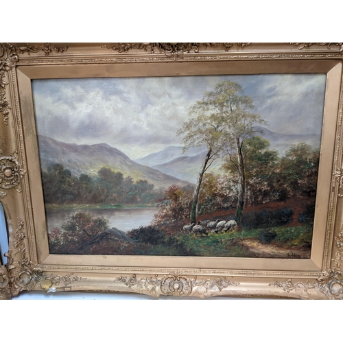 393 - J Allen - a pair of lake scenes, each with sheep and trees, oil on canvas, 50cm x 76cm, in gilt fram... 