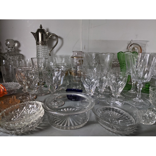 76 - A quantity of table glass to include Victorian drinking glasses, silver plate and glass claret jug, ... 