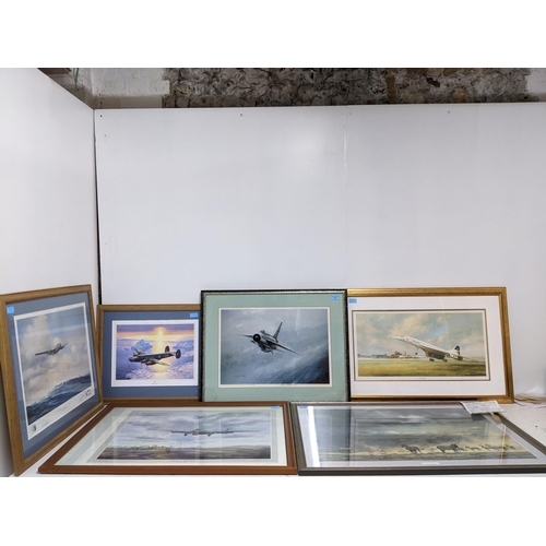 77 - A mixed lot of framed and glazed prints depicting military and other aircrafts, along with a David S... 