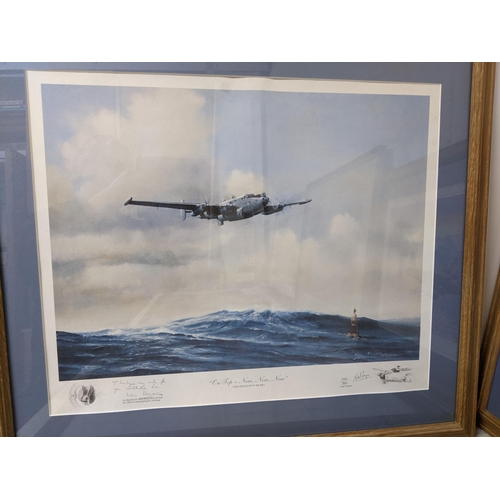 77 - A mixed lot of framed and glazed prints depicting military and other aircrafts, along with a David S... 