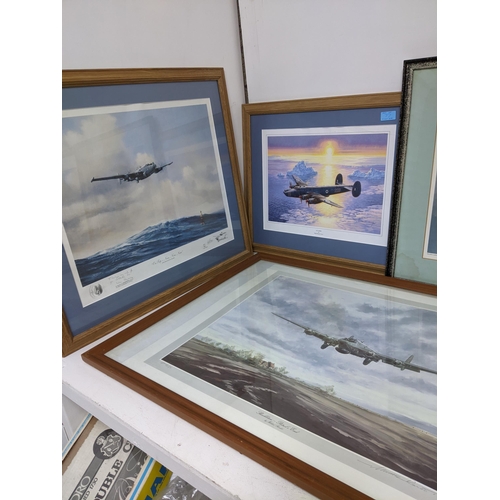 77 - A mixed lot of framed and glazed prints depicting military and other aircrafts, along with a David S... 