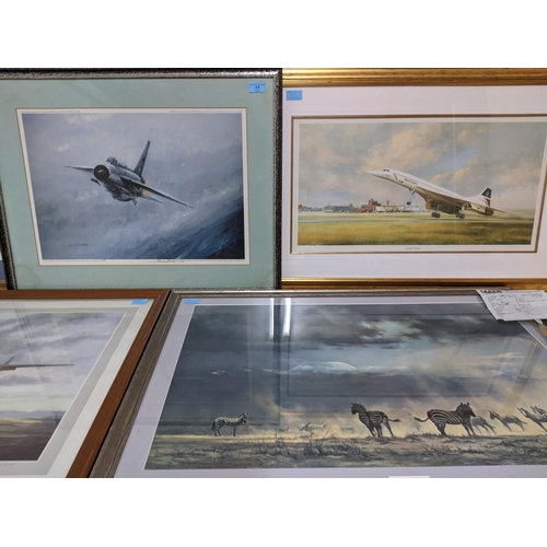 77 - A mixed lot of framed and glazed prints depicting military and other aircrafts, along with a David S... 