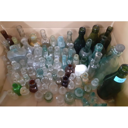 282 - A quantity of approx 85 Victorian and later glass bottles to include poison, ink and beer bottles. L... 