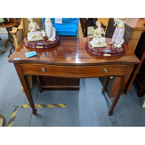 337 - A modern reproduction Edwardian side table with a single drawer raised on tapered legs and spade fee... 