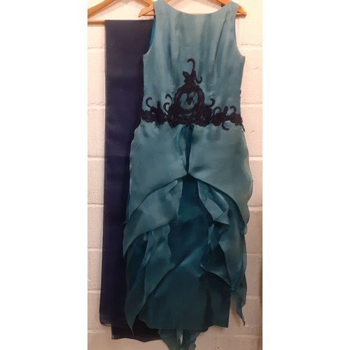 114 - A 2000's Wim Hemmink teal silk sleeveless evening gown, UK size 14, having navy lace applique to the... 