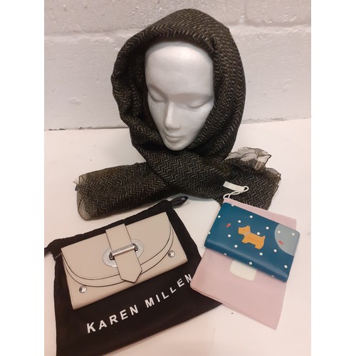 9 - Karen Millen and Radley- A Karen Millen cream leather clutch having silver tone hardware and branded... 