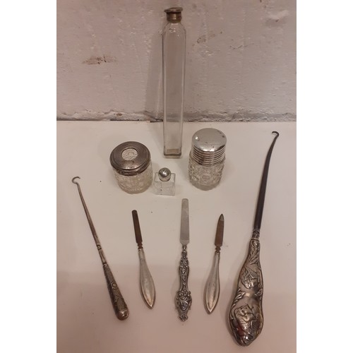 113 - A group of silver, white metal and glass dressing table and boudoir items to include 2 button hooks,... 